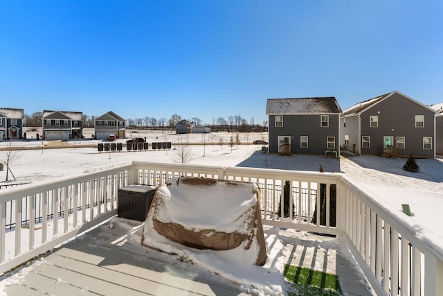 view of snow covered deck