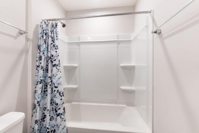 bathroom featuring toilet and shower / bathtub combination with curtain