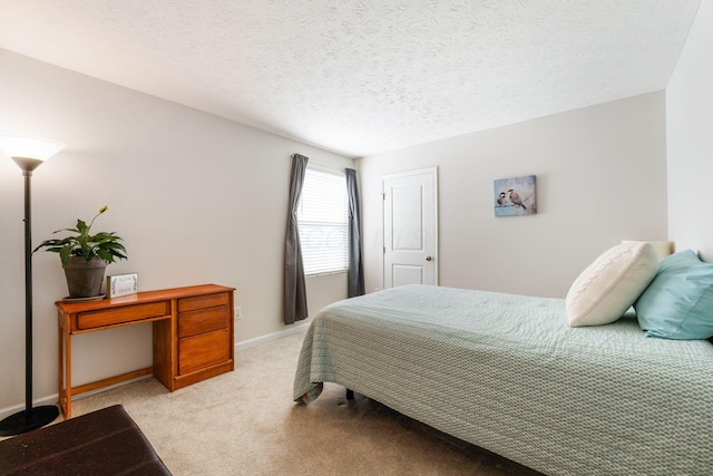 carpeted bedroom with a textured ceiling