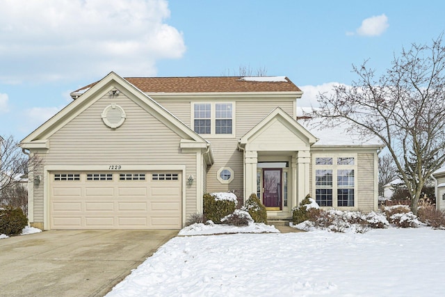 traditional-style home featuring concrete driveway