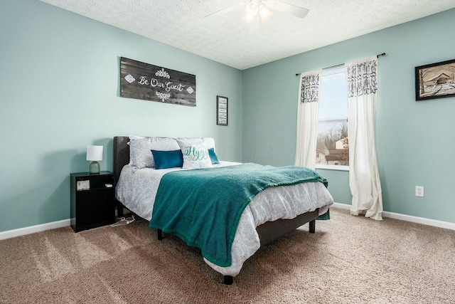 bedroom with a textured ceiling, ceiling fan, carpet, and baseboards