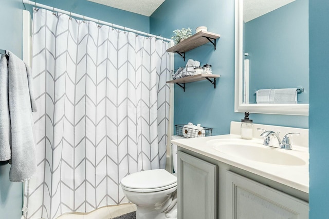 bathroom with toilet, a shower with curtain, a textured ceiling, and vanity