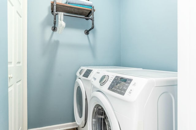 washroom featuring laundry area and washer and dryer