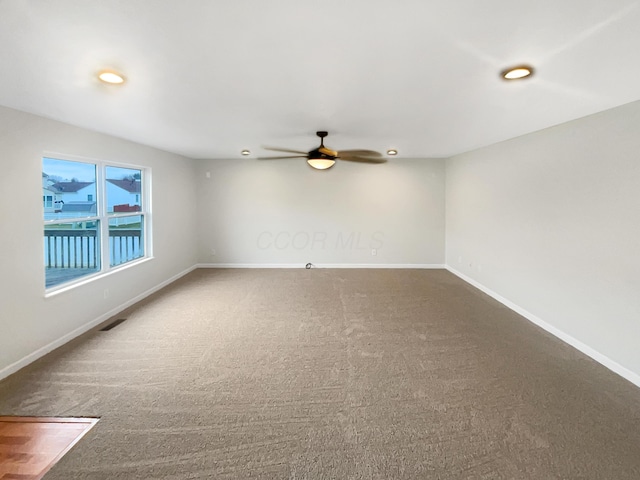 unfurnished room with carpet floors and ceiling fan