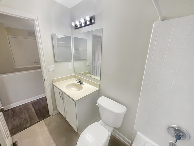 bathroom with toilet and vanity