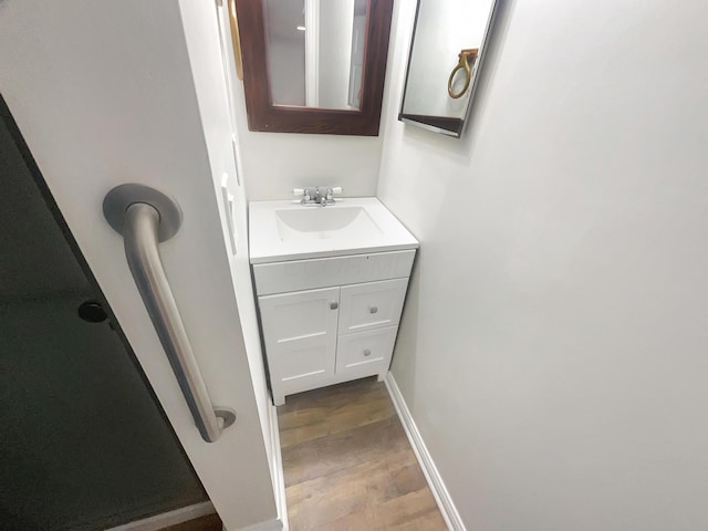 bathroom featuring vanity and wood-type flooring