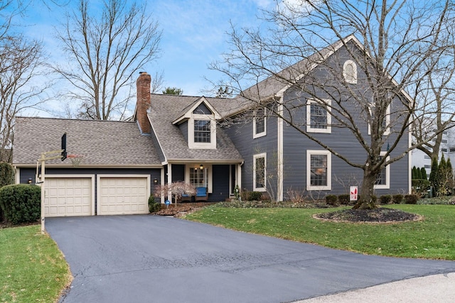 view of front of house featuring a garage, covered porch, and a front lawn