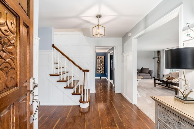 foyer entrance featuring dark hardwood / wood-style floors