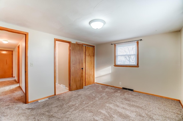 unfurnished bedroom with light carpet