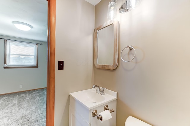 bathroom with vanity and toilet