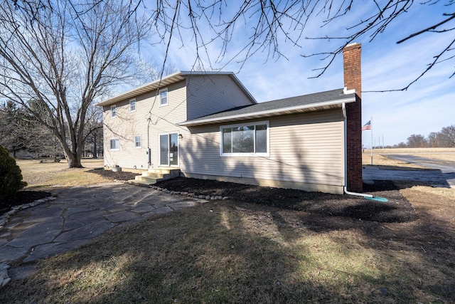 back of house with a patio