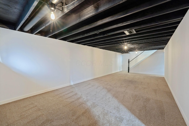 basement with carpet flooring