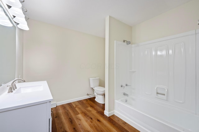 full bathroom featuring vanity, toilet, shower / washtub combination, and wood-type flooring