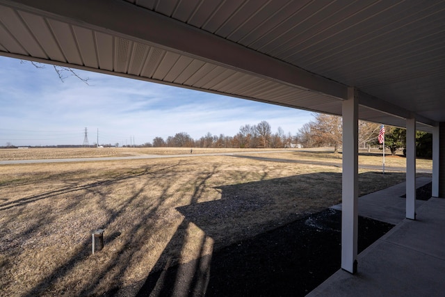 view of yard with a rural view