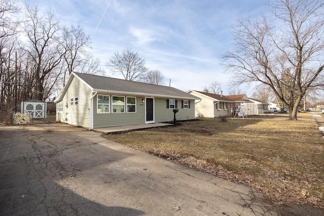 ranch-style home with a shed