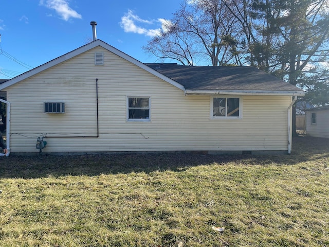 exterior space with crawl space and a lawn