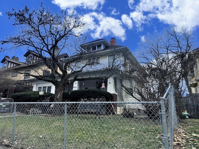 view of home's exterior featuring fence private yard and a chimney