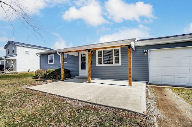 ranch-style home with a garage and a front yard