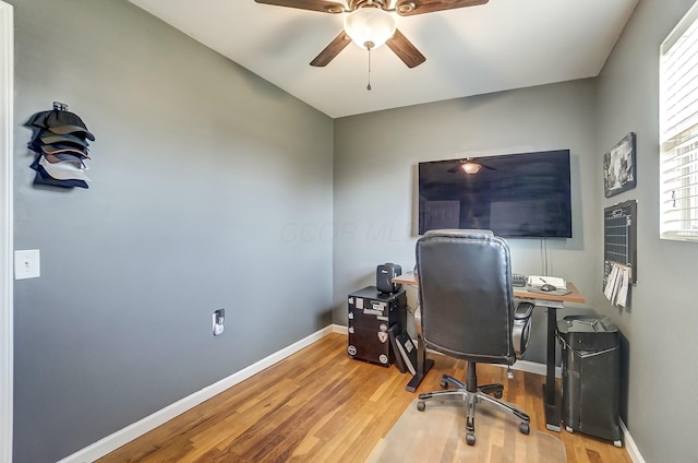 office space with hardwood / wood-style floors and ceiling fan