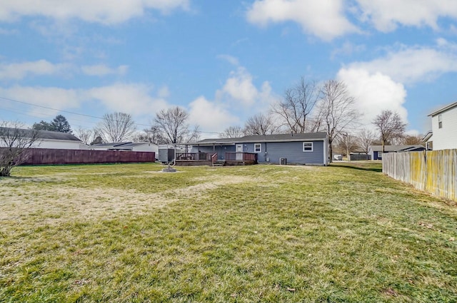 view of yard with a wooden deck