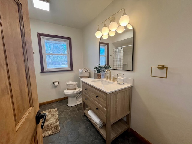 bathroom featuring a shower with curtain, vanity, and toilet