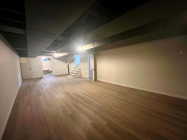 basement with wood-type flooring