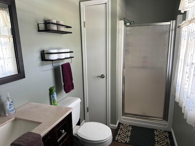 1048 Parkway Dr, Logan, OH 43138 - bathroom featuring toilet, a shower stall, and vanity