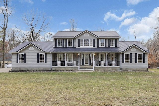 view of front of property with covered porch, metal roof, and a front yard