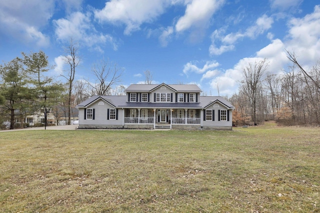 view of front of property with metal roof, a porch, and a front yard