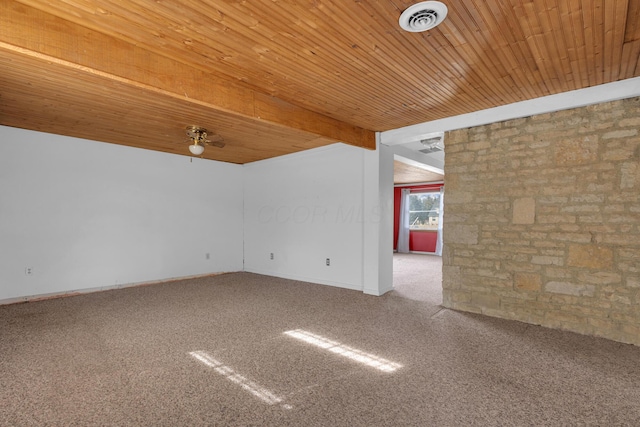 carpeted spare room with ceiling fan, beam ceiling, and wooden ceiling