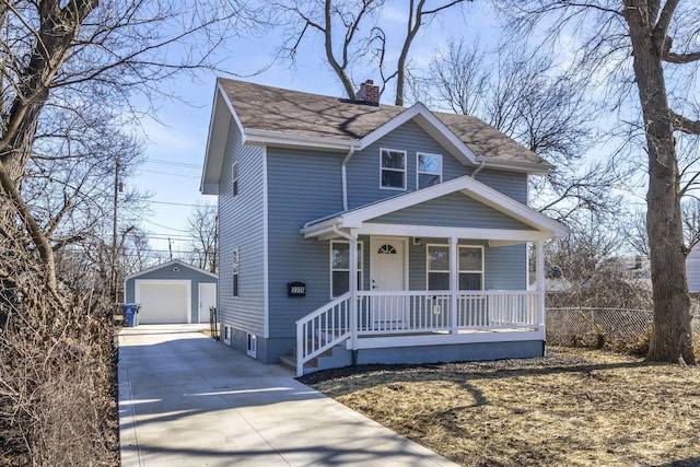 view of front of house featuring a garage, an outdoor structure, and a porch