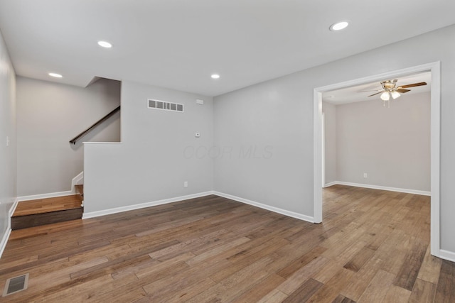 unfurnished room featuring hardwood / wood-style flooring and ceiling fan