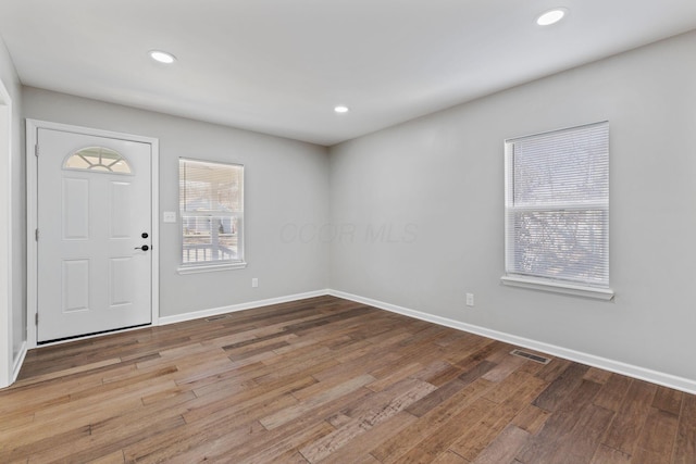 foyer entrance with light hardwood / wood-style flooring