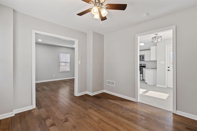 spare room featuring ceiling fan and wood-type flooring