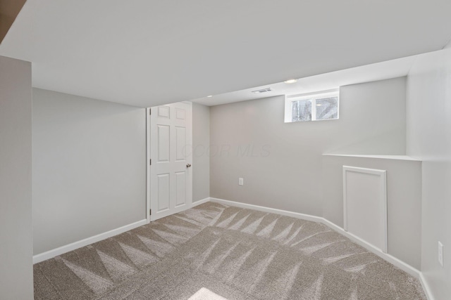 basement with carpet flooring