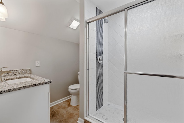 bathroom with walk in shower, tile patterned floors, vanity, and toilet