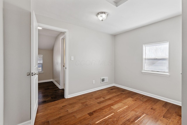 spare room with hardwood / wood-style floors