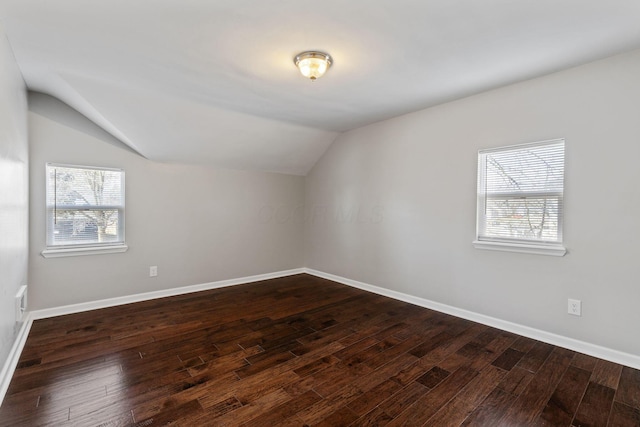 bonus room featuring lofted ceiling and dark hardwood / wood-style floors