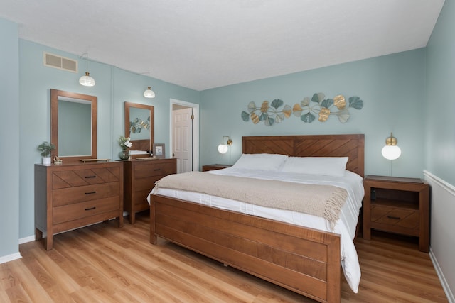 bedroom with light hardwood / wood-style floors