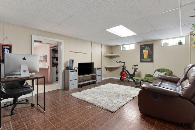 living room with a drop ceiling