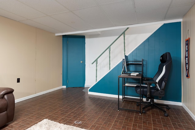 office with a paneled ceiling