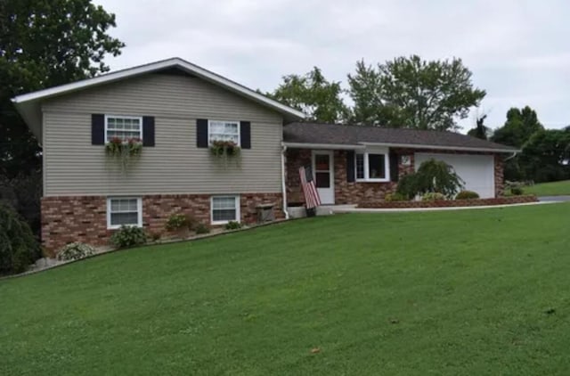 split level home featuring a garage and a front yard