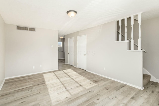 empty room with light wood-type flooring