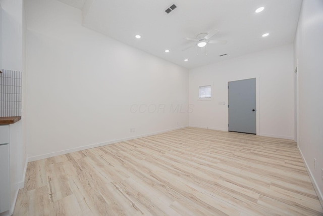 spare room with ceiling fan and light hardwood / wood-style flooring