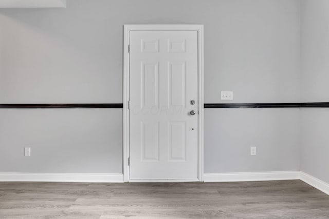 spare room featuring light hardwood / wood-style floors