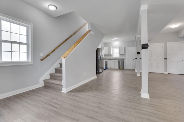 unfurnished living room featuring light wood-type flooring