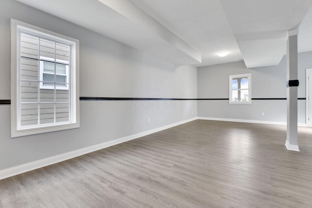 empty room with hardwood / wood-style flooring