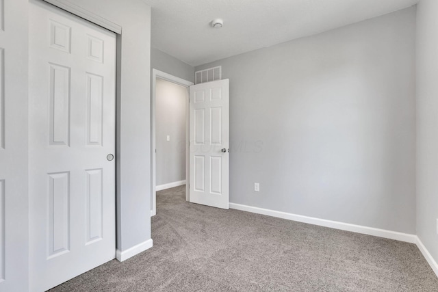 unfurnished bedroom featuring carpet flooring