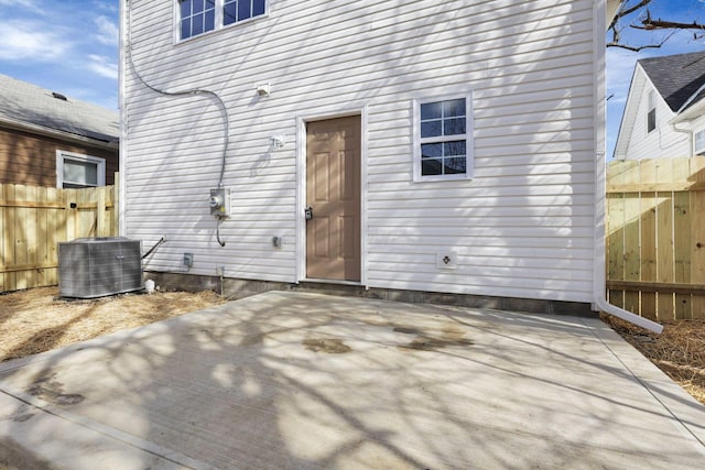 rear view of house featuring central AC and a patio