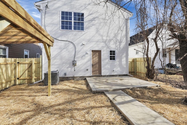 back of house featuring central AC unit and a patio area